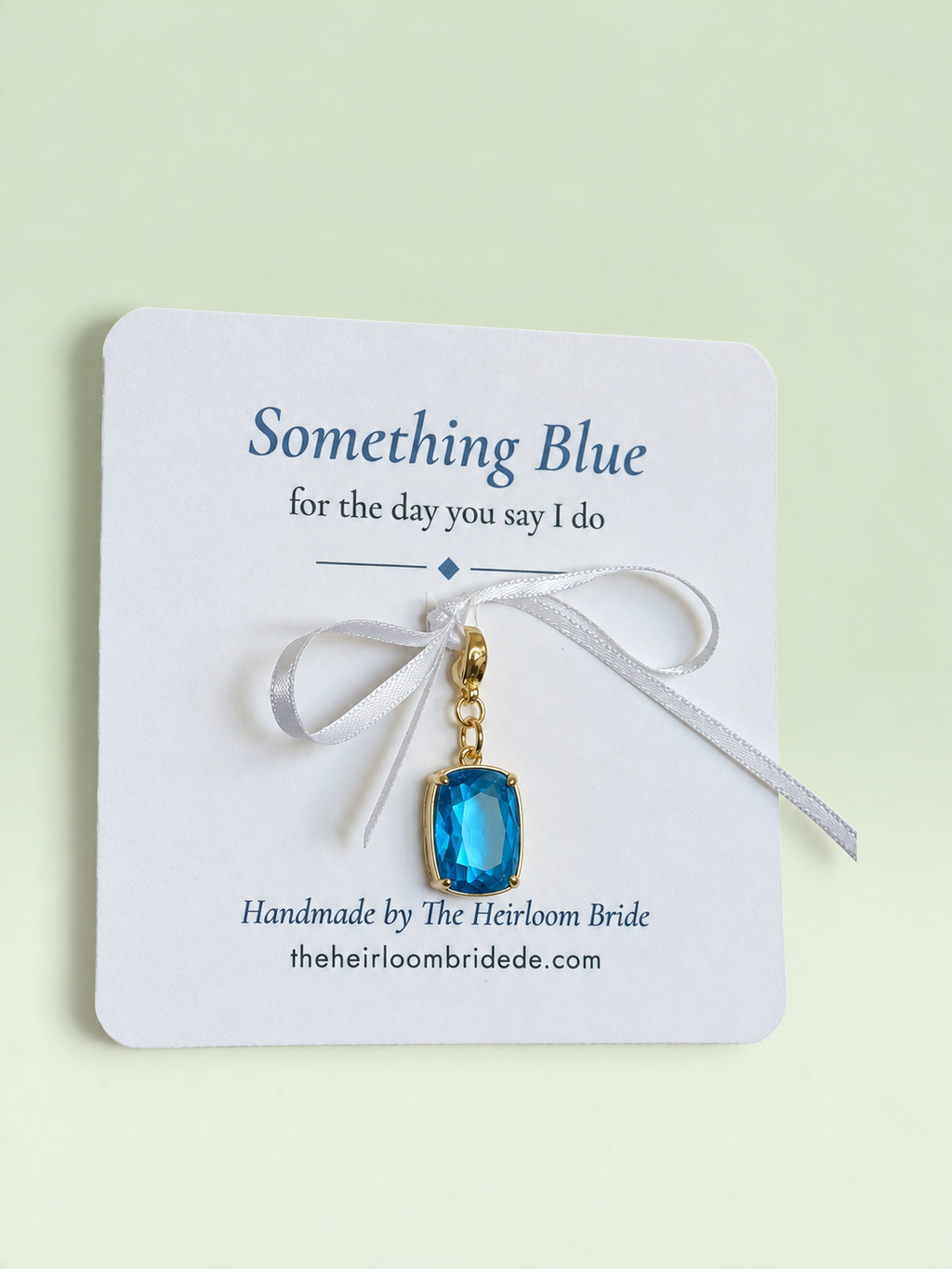 Something blue crystal charm on bouquet wrap