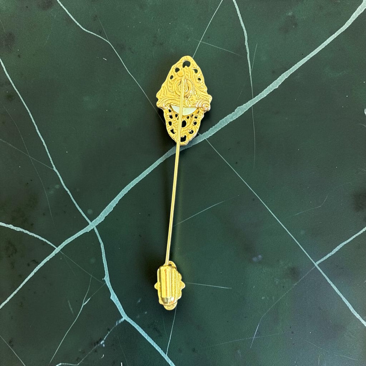 Vintage filigree stick pin with filigree clutch